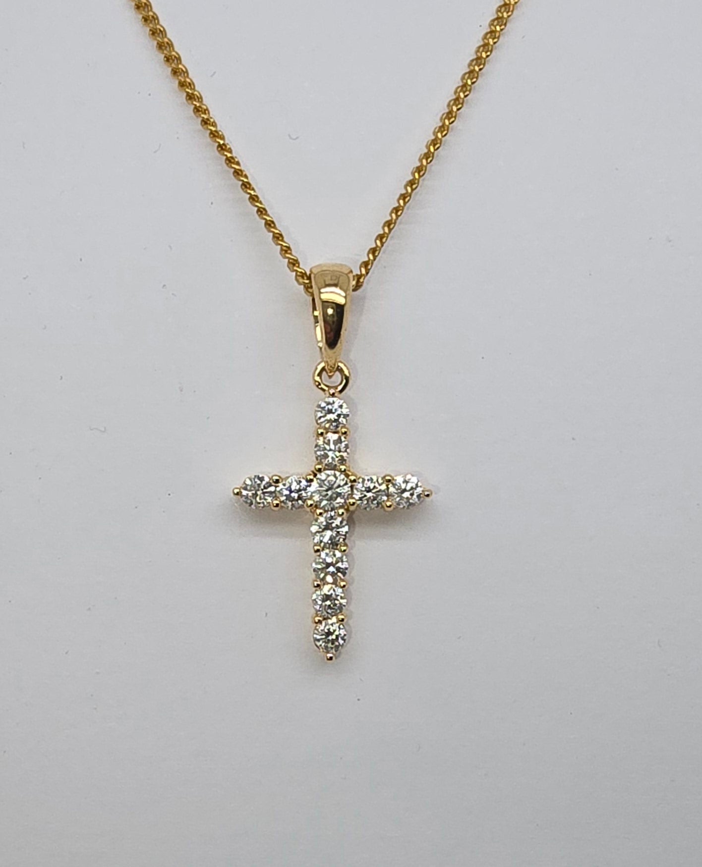 18CT YELLOW GOLD DIAMOND CLAW SET CROSS PENDANT