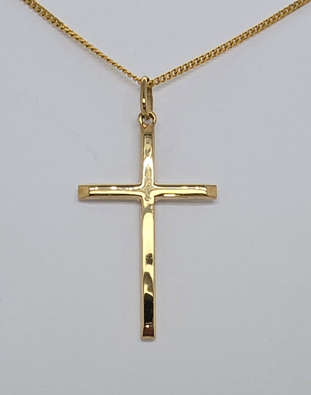 9CT YELLOW GOLD ITALIAN SQUARED EDGE 31MM X 20MM CROSS.