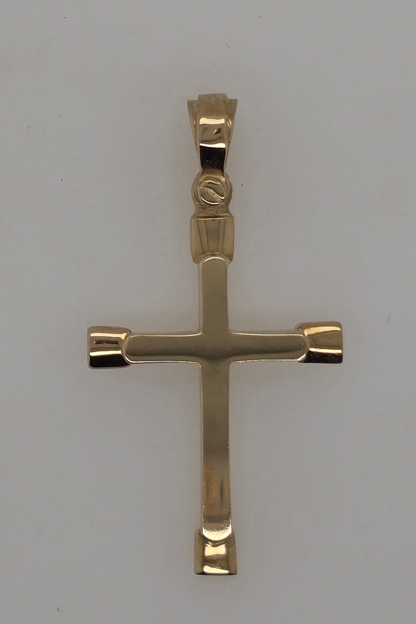 9CT YELLOW GOLD IMPORTED 28MM X 17MM FANCY CROSS.