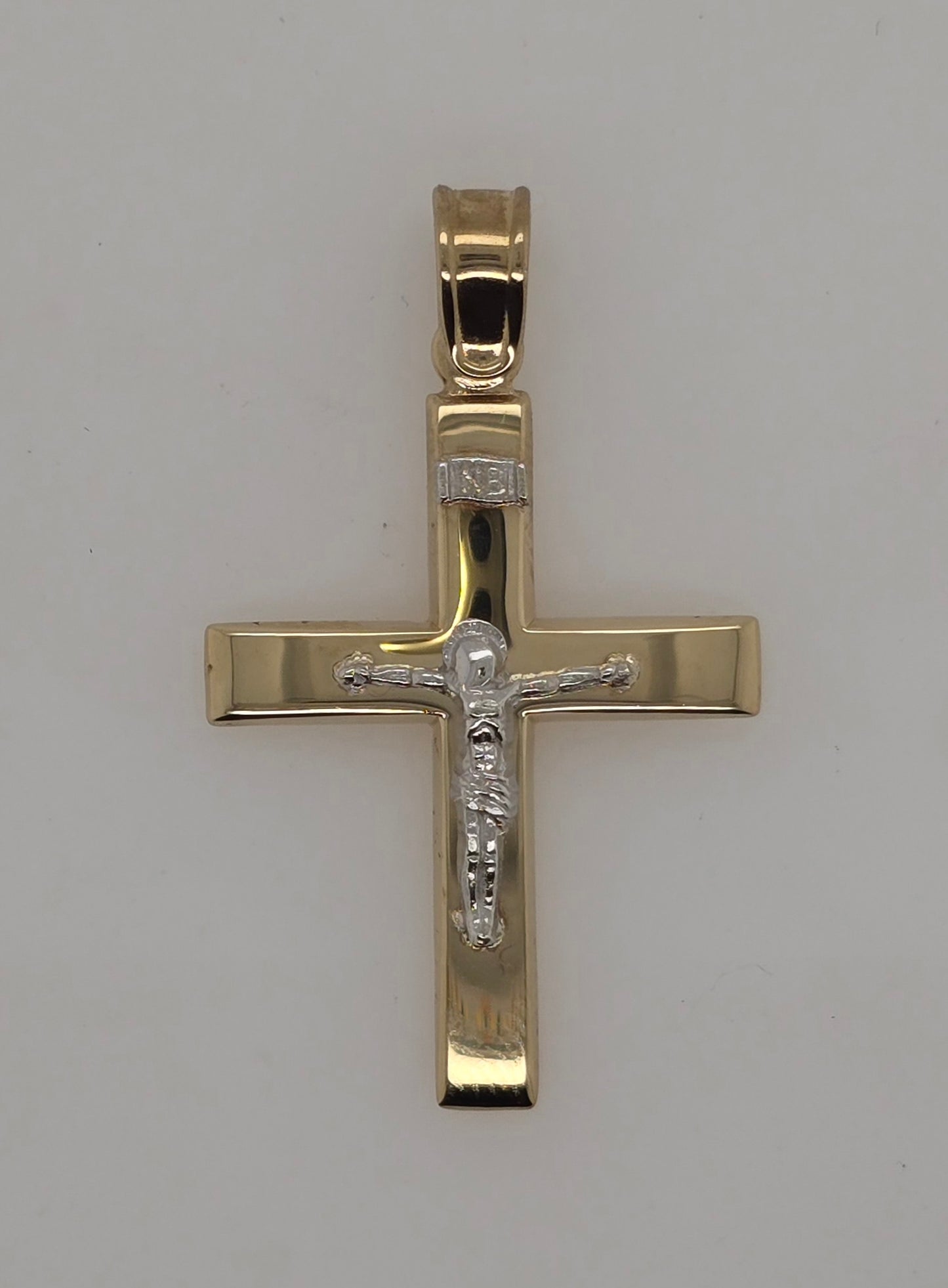 9CT TWO TONE IMPORTED CRUCFIX WITH WHITE GOLD CENTER.