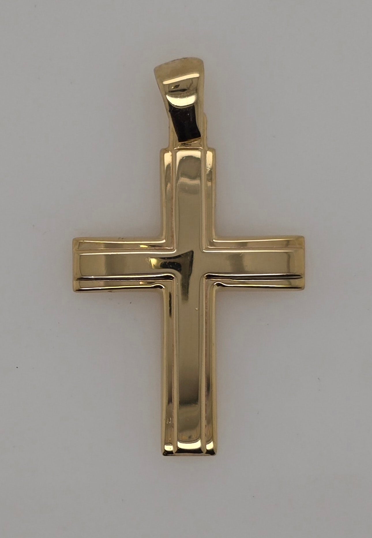 9CT YELLOW GOLD IMPORTED POLISHED CROSS WITH SLIGHT CURVE.