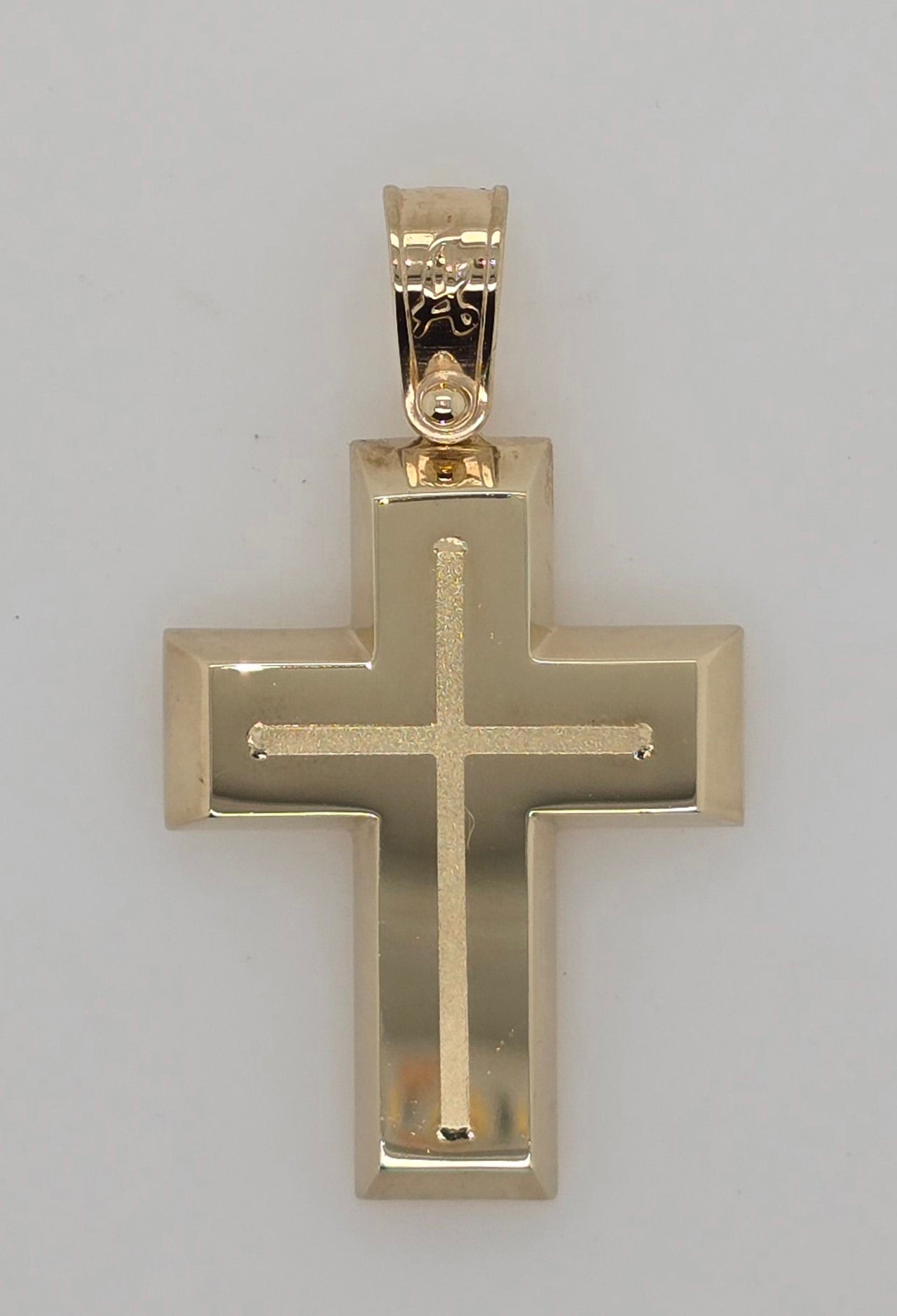9CT YELLOW GOLD IMPORTED POLISHED CROSS WITH RAISED CENTRE.
