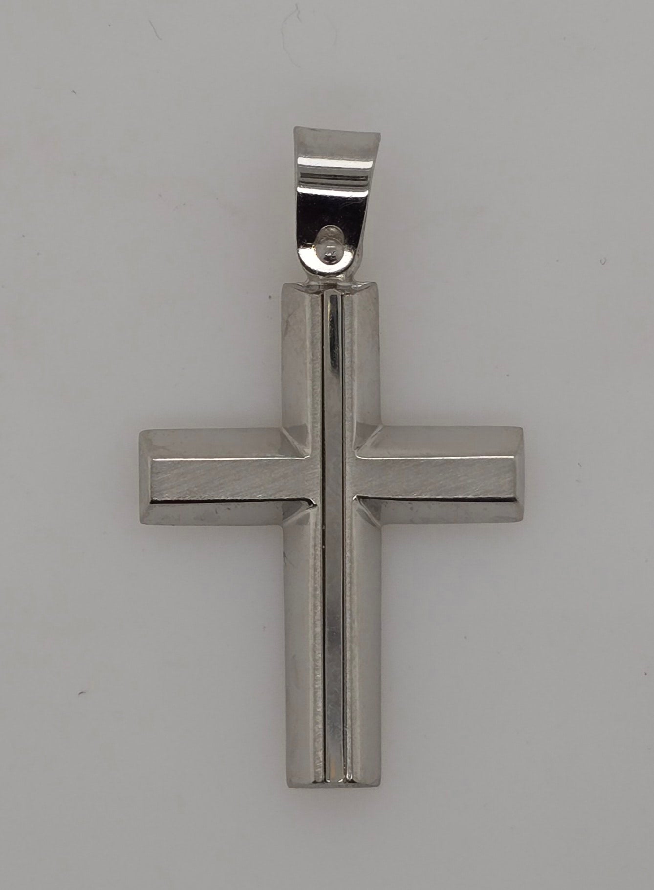 9CT WHITE GOLD IMPORTED POLISHED CROSS.