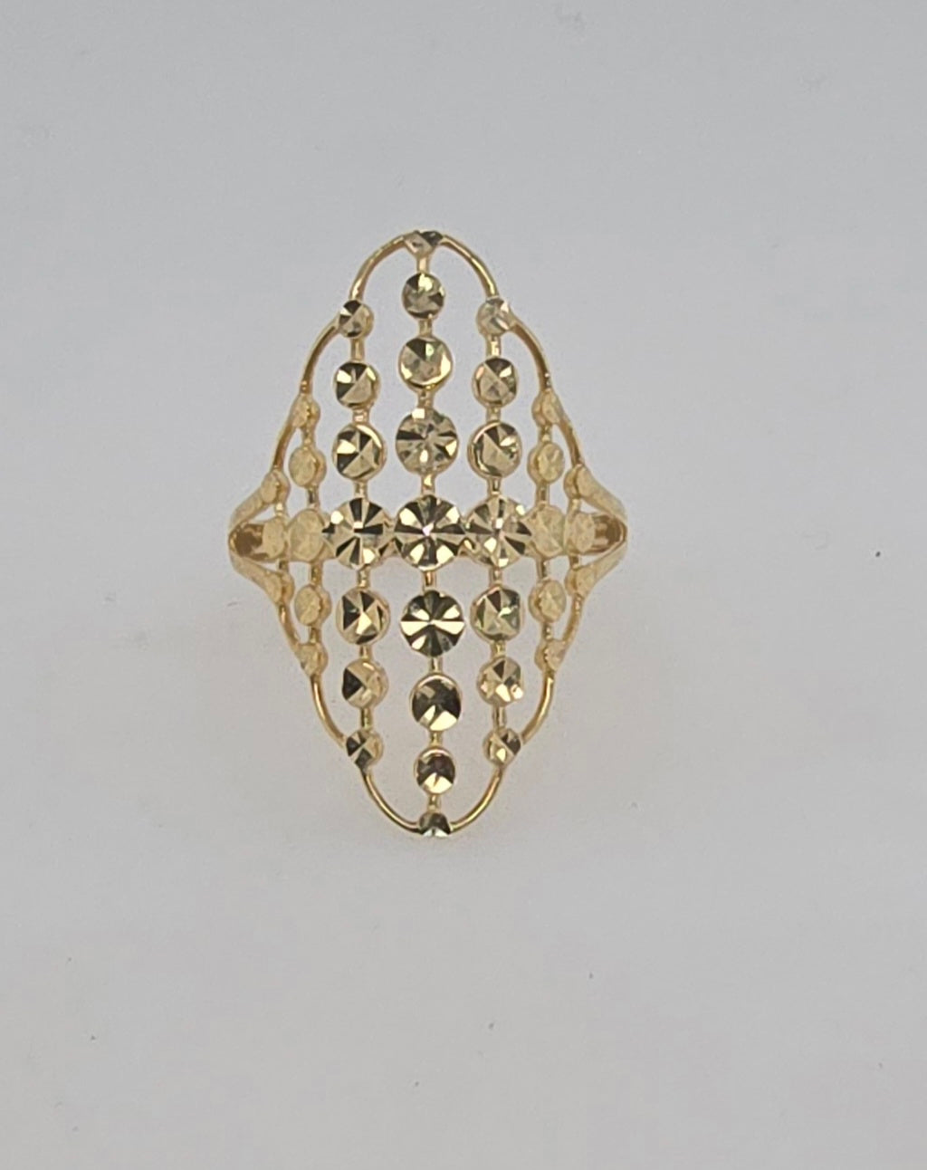 9CT YELLOW GOLD MARQUISE SHAPE 27 X 17MM RING WITH FACETED BEADING.