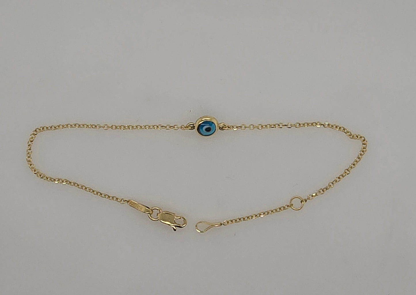9CT YELLOW GOLD IMPORTED 5.5MM EVIL EYE 18-20CM BRACELET.