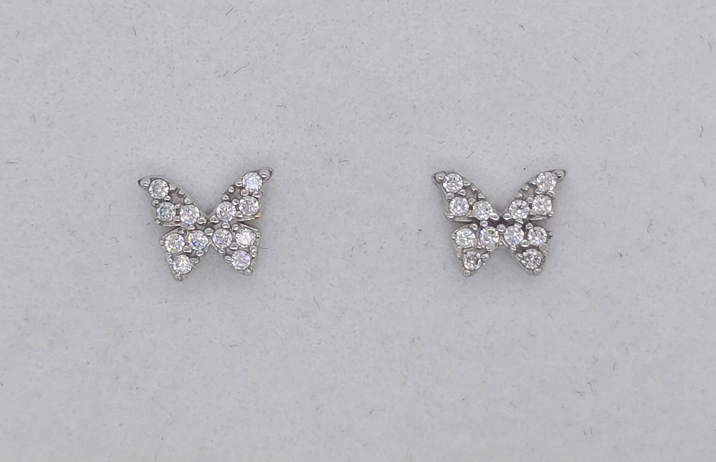 9CT WHITE GOLD 5.5MM BUTTERFLY CUBIC ZIRCONIA STUD EARRINGS.