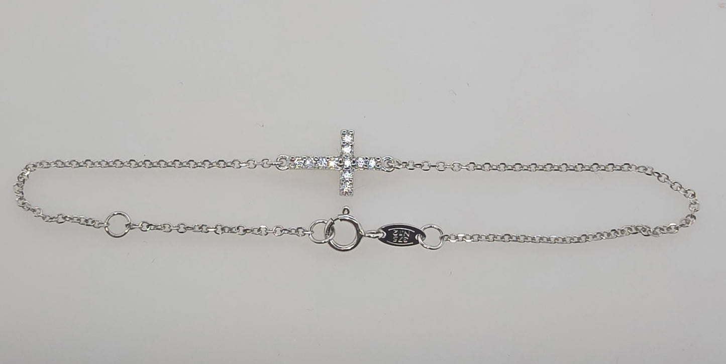 9CT WHITE GOLD IMPORTED CUBIC ZIRCONIA CROSS 16-18CM BRACELET.
