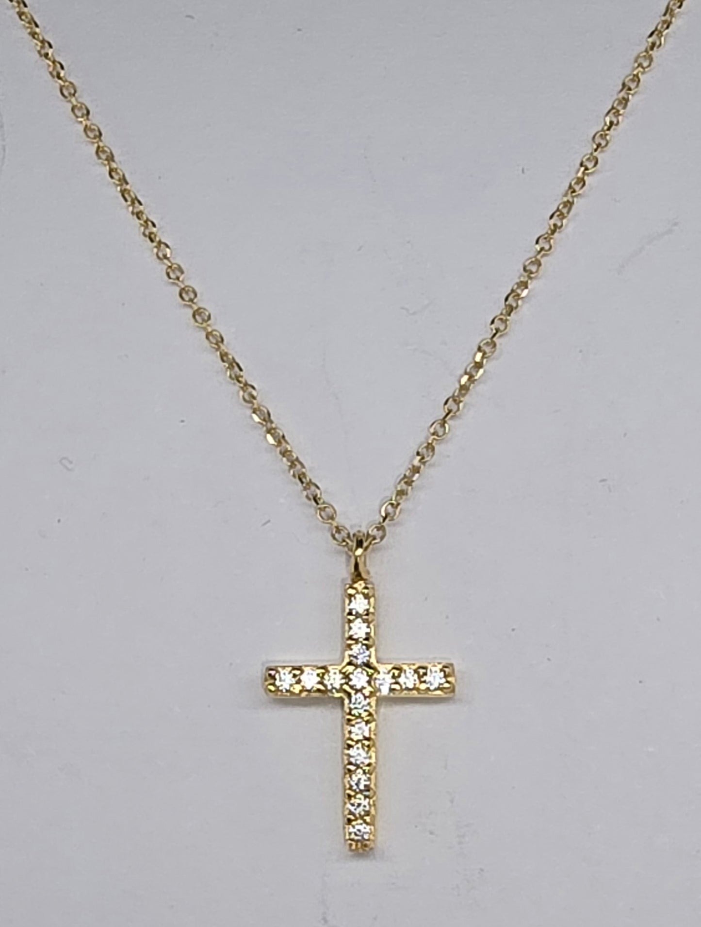 9CT YELLOW GOLD 40CM TRACE CHAIN WITH CUBIC ZIRCONIA CROSS PENDANT.