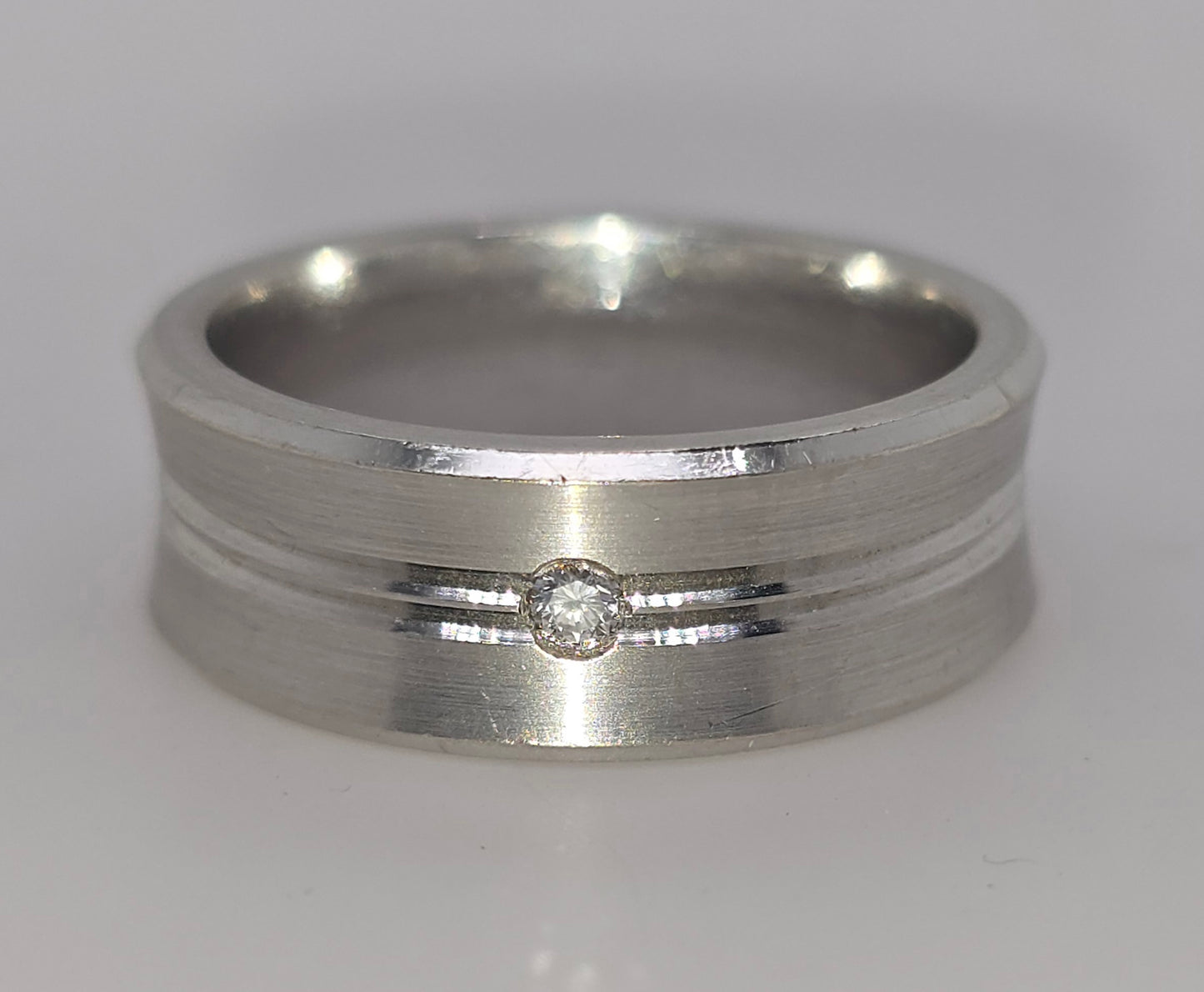 9CT WHITE GOLD 8MM CONCAVE DIAMOND RING.