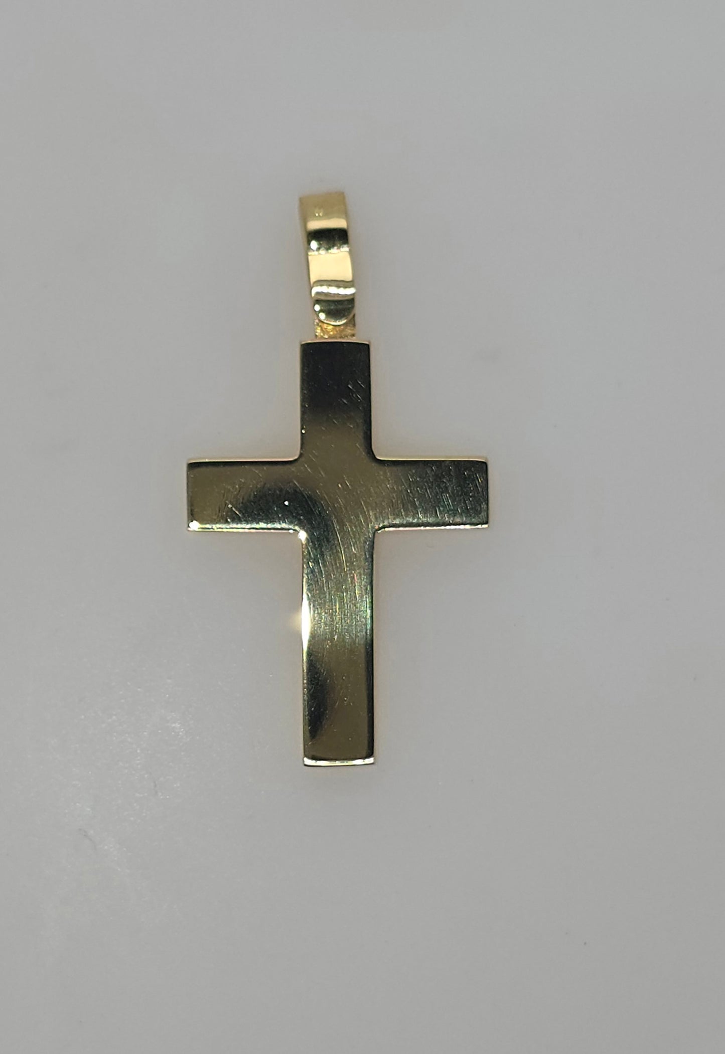18CT YELLOW GOLD IMPORTED POLISHED CROSS.