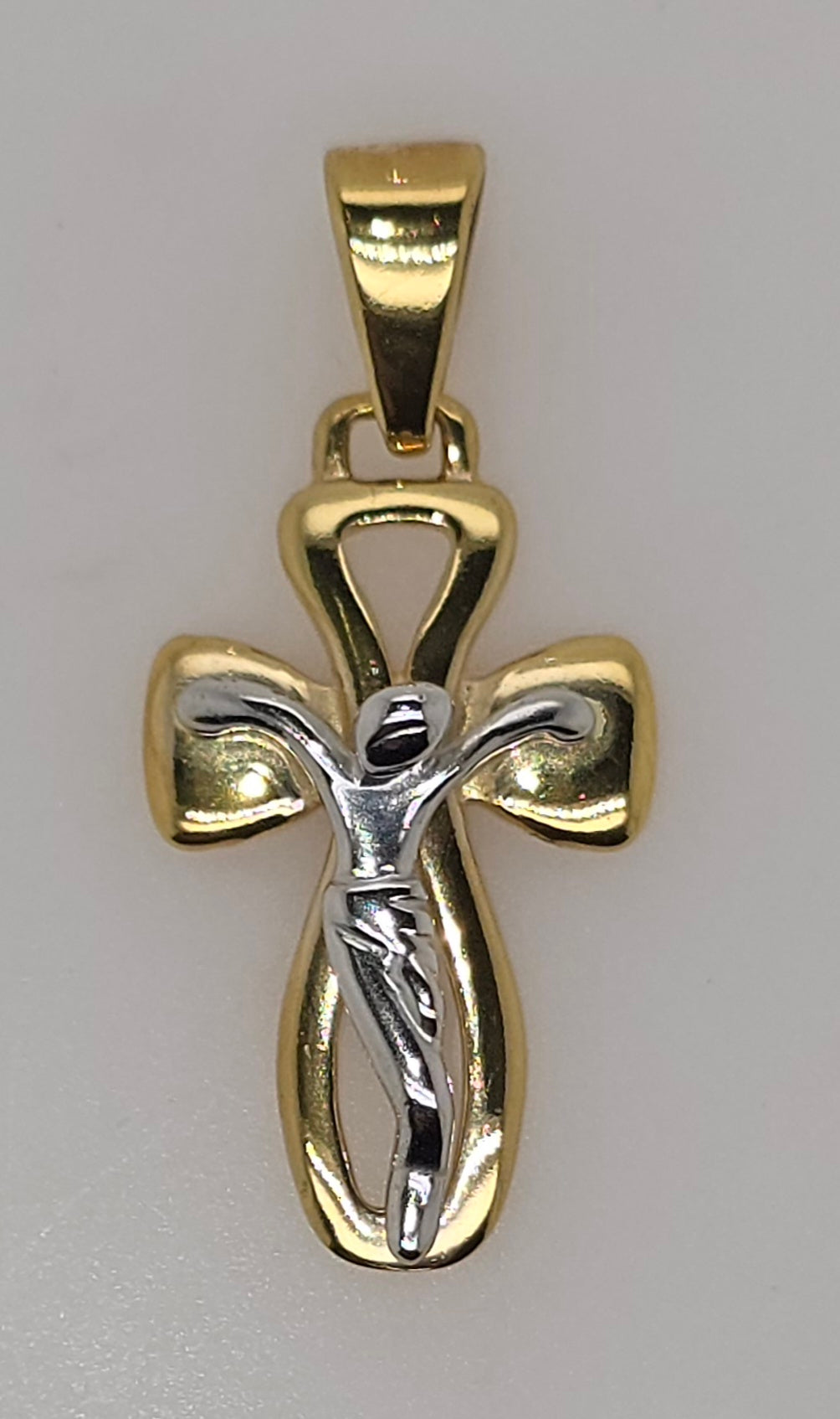 18CT TWO TONE IMPORTED 22MM X 14MM FANCY CRUCIFIX PENDANT.
