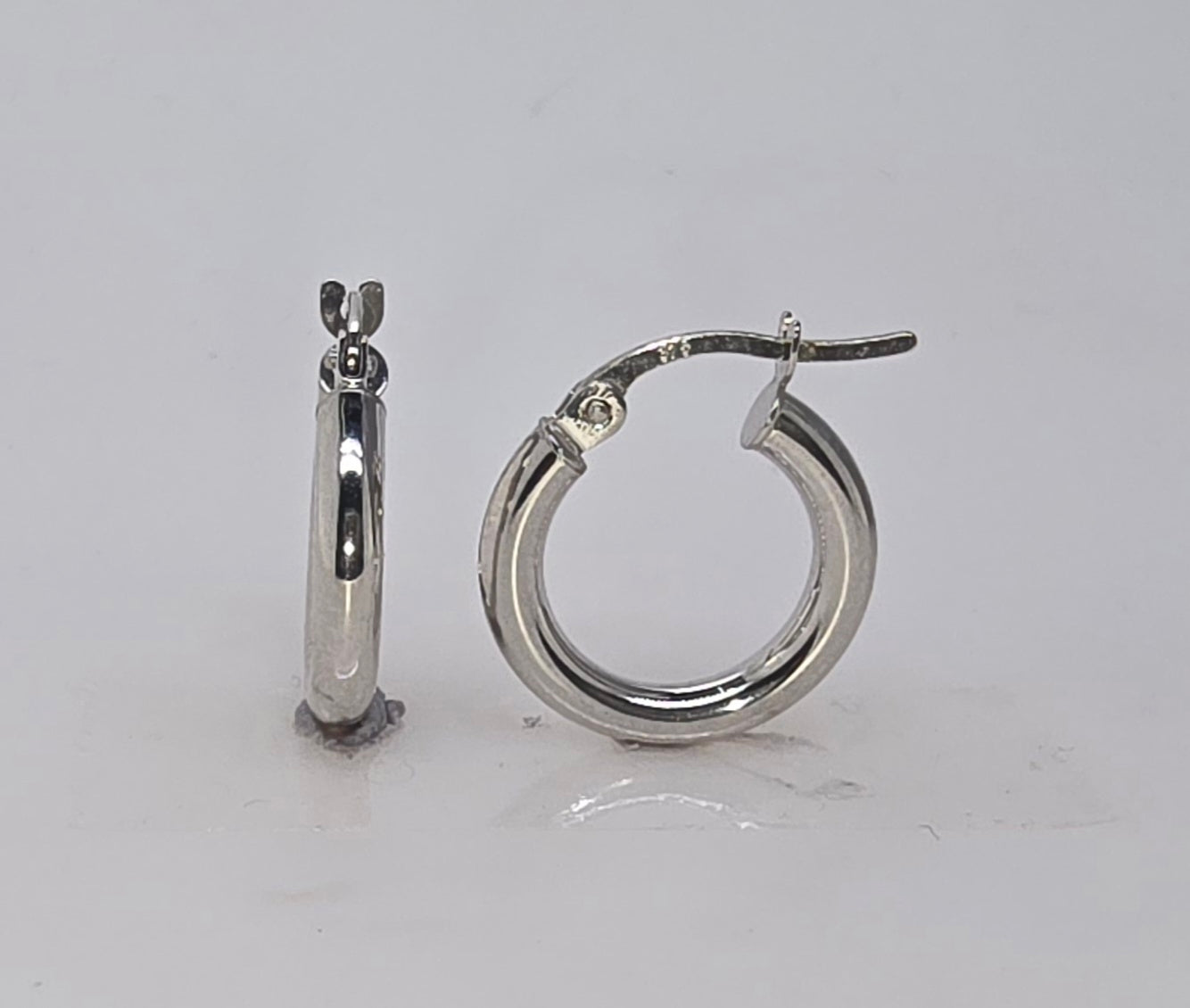 9CT WHITE GOLD IMPORTED HOOP EARRINGS.