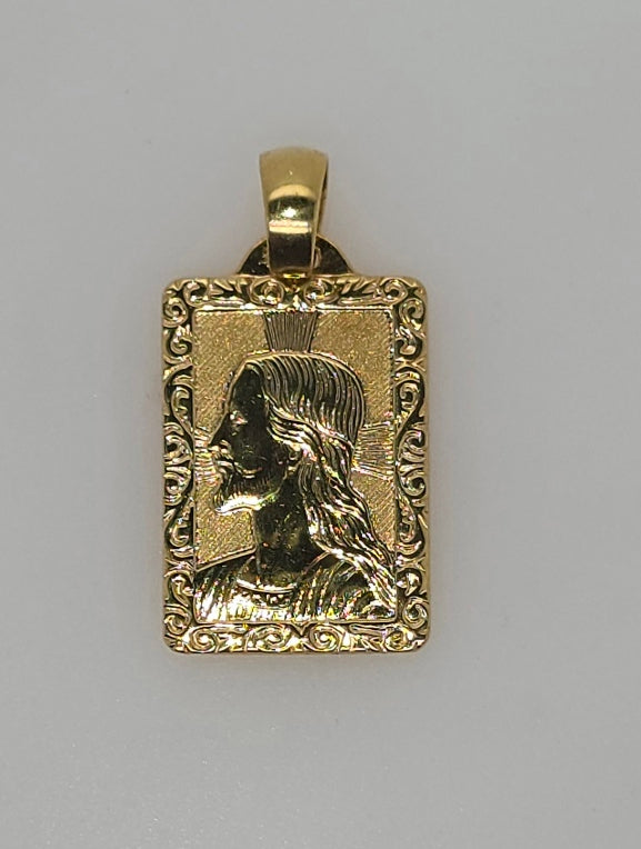 18CT YELLOW GOLD IMPORTED JESUS RECTANGULAR PENDANT.