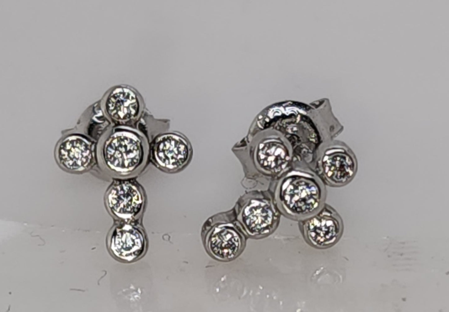 STERLING SILVER BEZEL SET 10MMX 8MM CUBIC ZIRCONIA CROSS STUD EARRINGS.