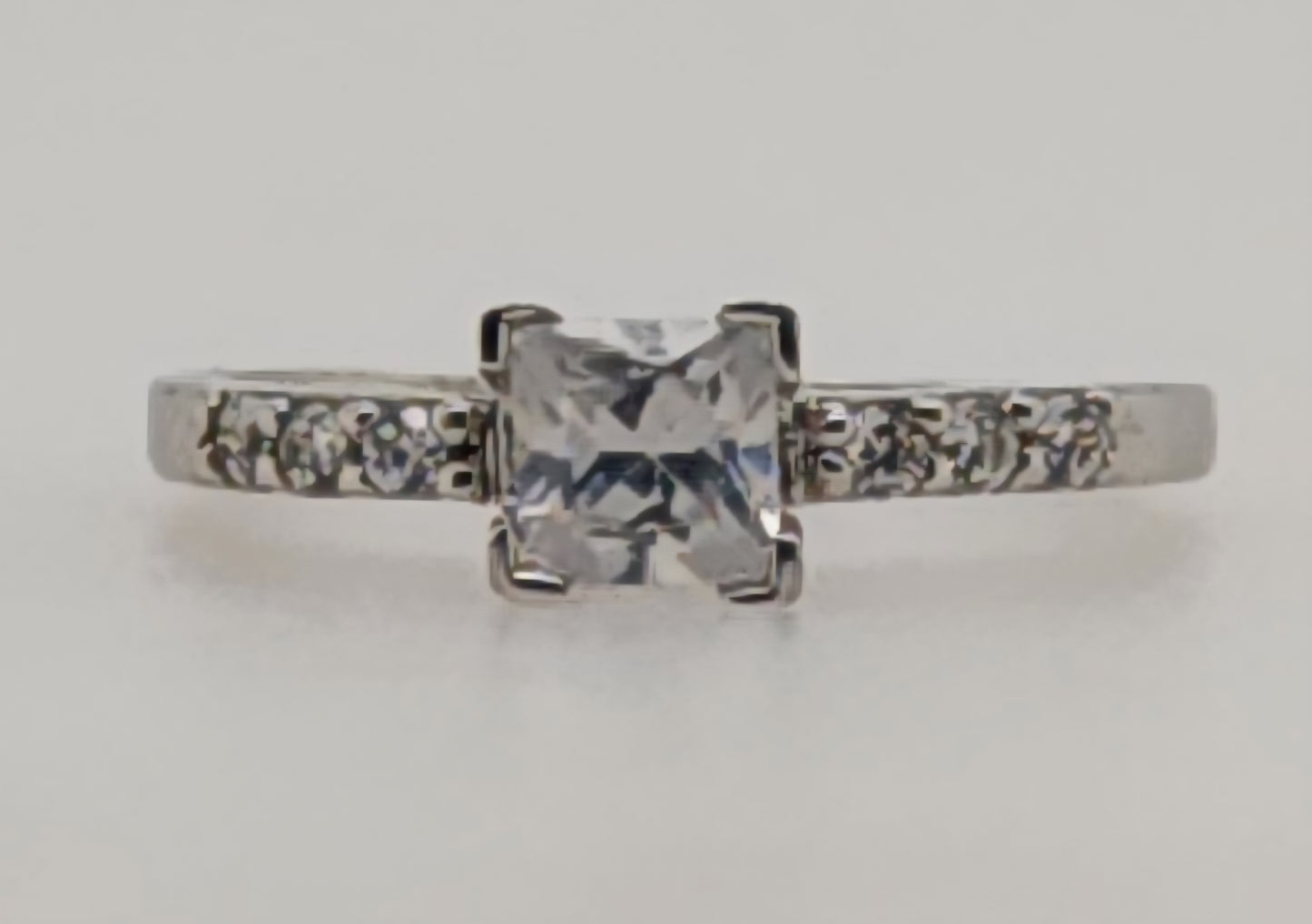 STERLING SILVER CLAW SET CUBIC ZIRCONIA PRINCESS CUT AND ROUND RING.