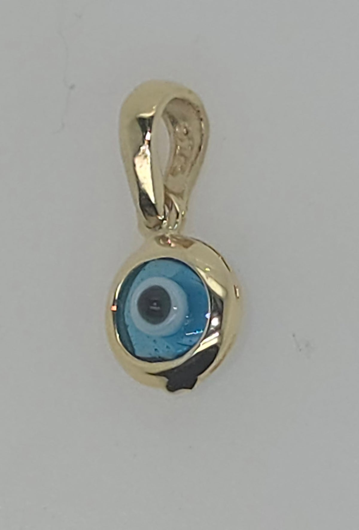 9CT YELLOW GOLD IMPORTED 5.8MM EVIL EYE PENDANT.