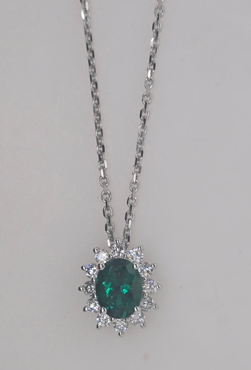 9CT WHITE GOLD LAB EMERALD AND DIAMOND PENDANT.