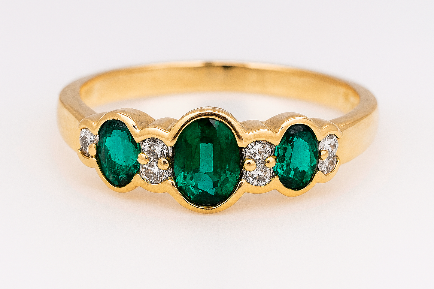 9CT YELLOW GOLD CREATED EMERALD AND DIAMOND RING.