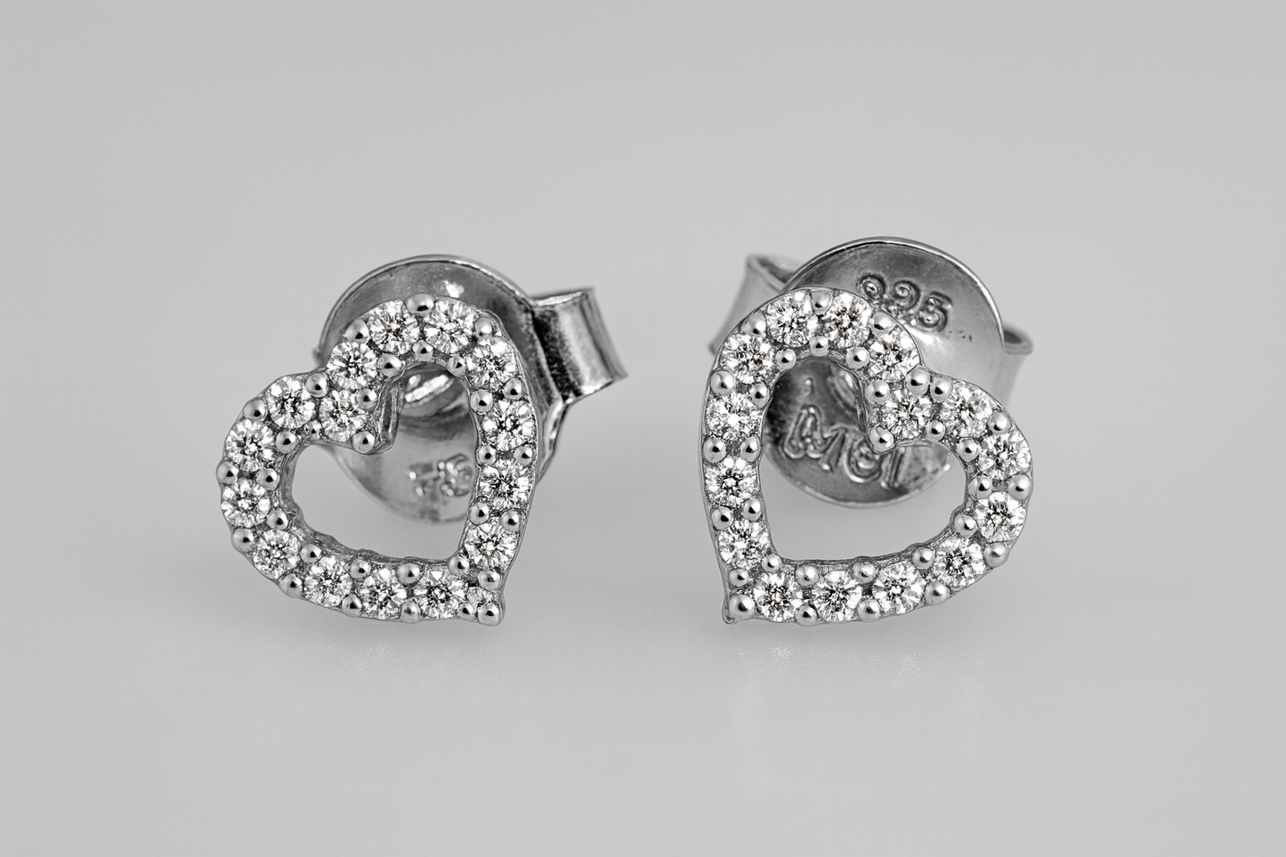 9CT WHITE GOLD IMPORTED OPEN 6.5MM CUBIC ZIRCONIA STUD EARRINGS.