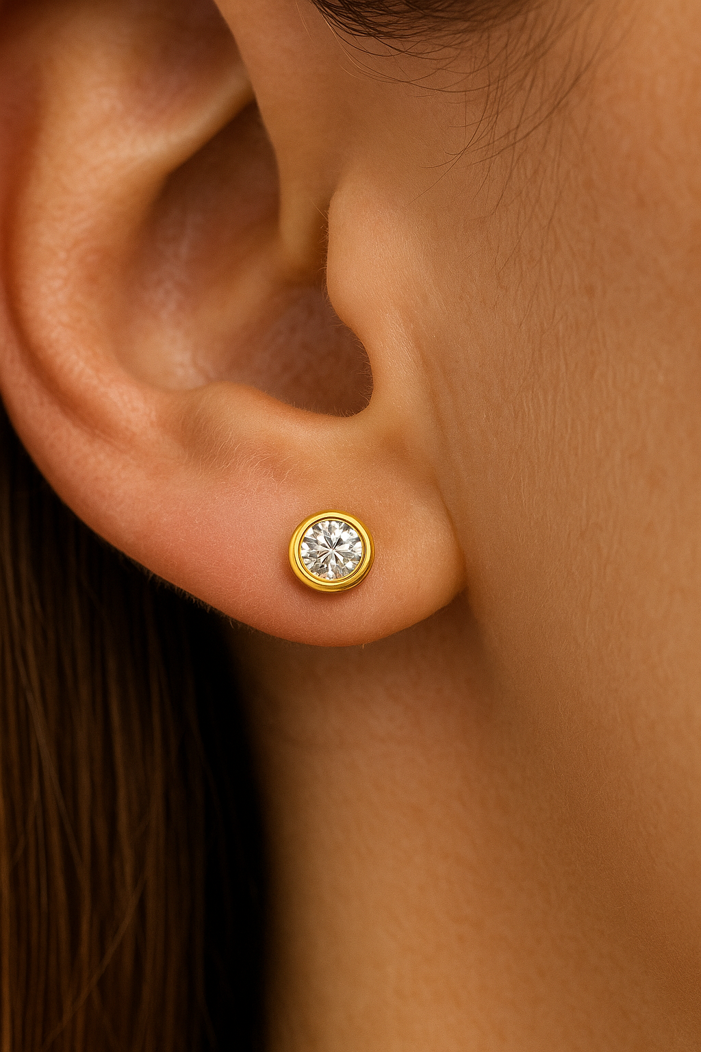 9CT YELLOW GOLD BEZEL SET DIAMOND STUD EARRINGS.