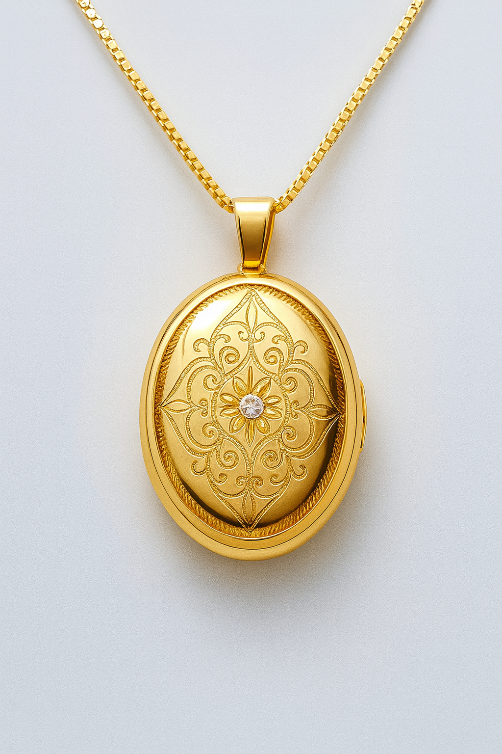 9CT YELLOW GOLD DIAMOND SET PATTERN OVAL LOCKET