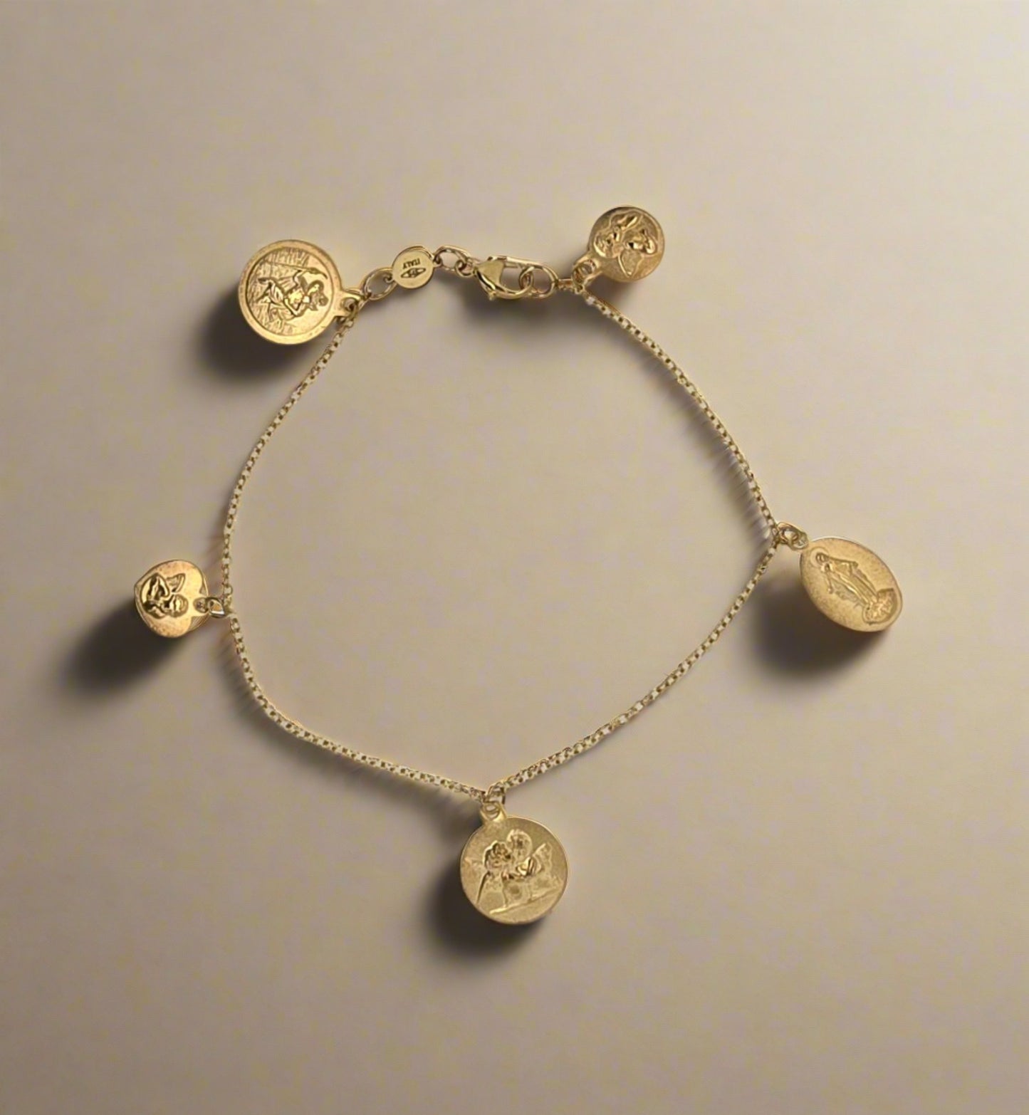 9CT YELLOW GOLD IMPORTED 19CM GUARDIAN RELIGIOUS CHARM BRACELET.