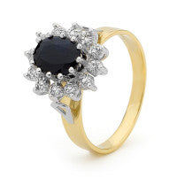 9CT YELLOW GOLD AUSTRALIAN OVAL SAPPHIRE AND DIAMOND CLUSTER RING.