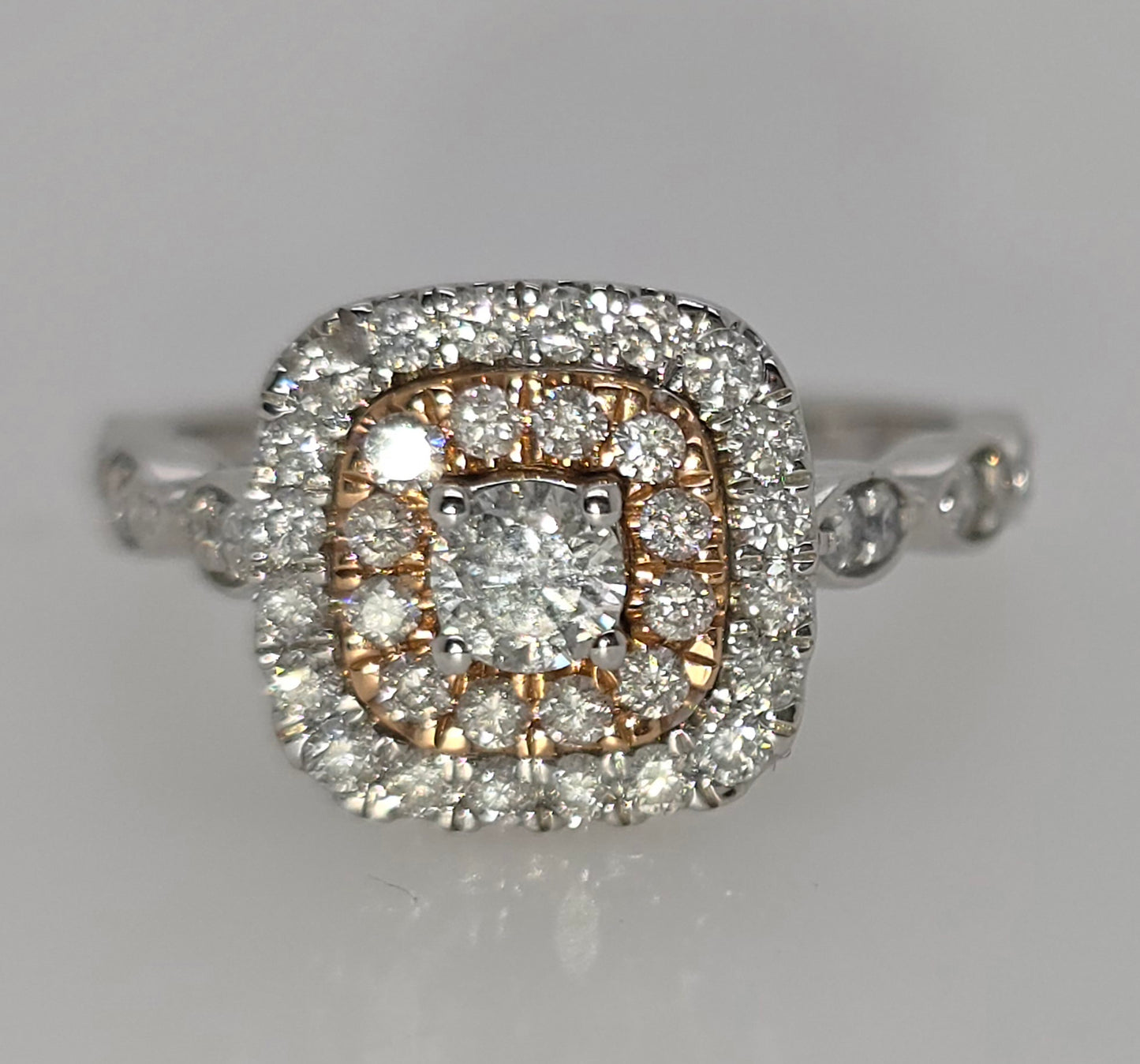 14CT TWO TONE FANCY DOUBLE HALO DIAMOND RING.