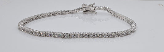 STERLING SILVER RHODIUM PLATED 18CM 2MM CUBIC ZIRCONIA TENNIS BRACELET.