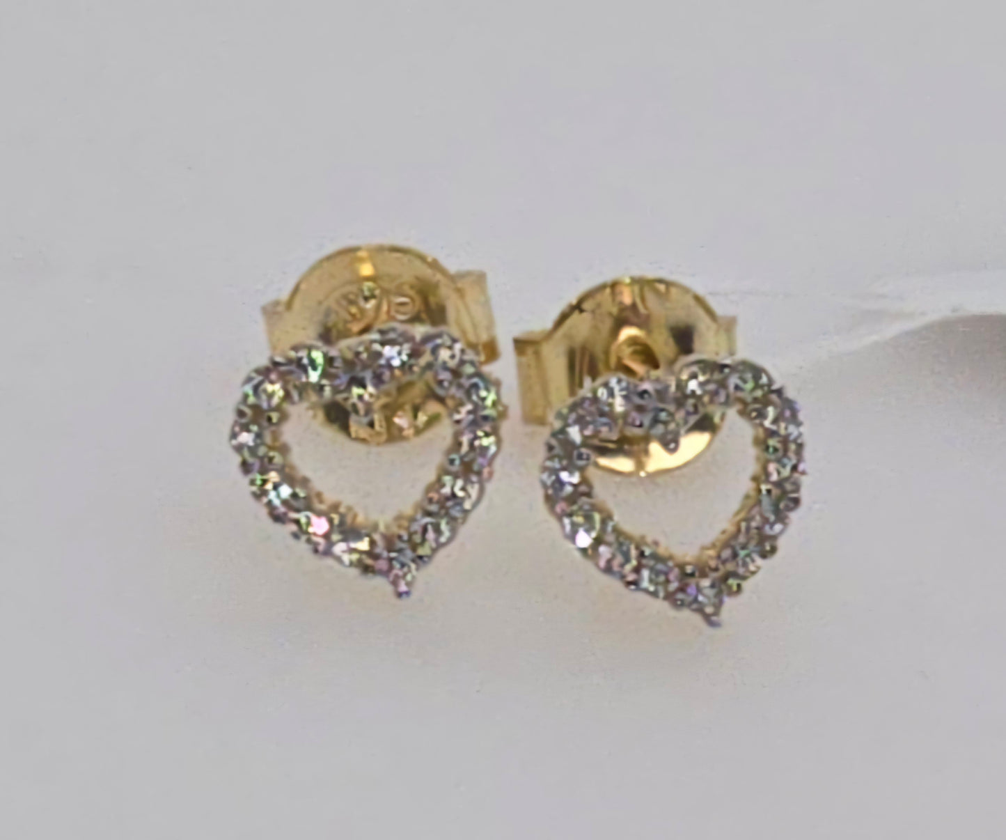 9CT YELLOW GOLD IMPORTED 6.3MM OPEN HEART CUBIC ZIRCONIA STUD EARRINGS.