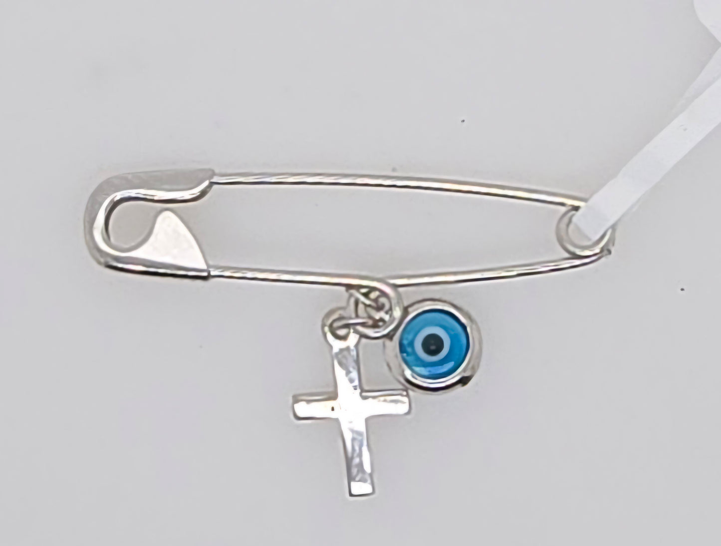 9CT WHITE GOLD IMPORTED EVIL EYE AND CROSS PIN.