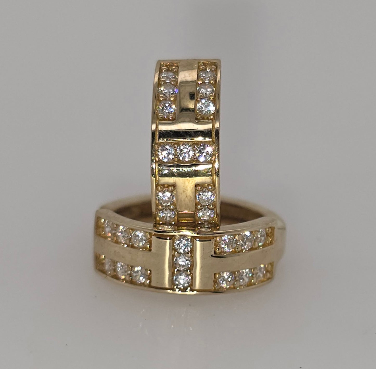 9CT YELLOW GOLD IMPORTED CUBIC ZIRCONIA FANCY 12MM HUGGIE EARRINGS.