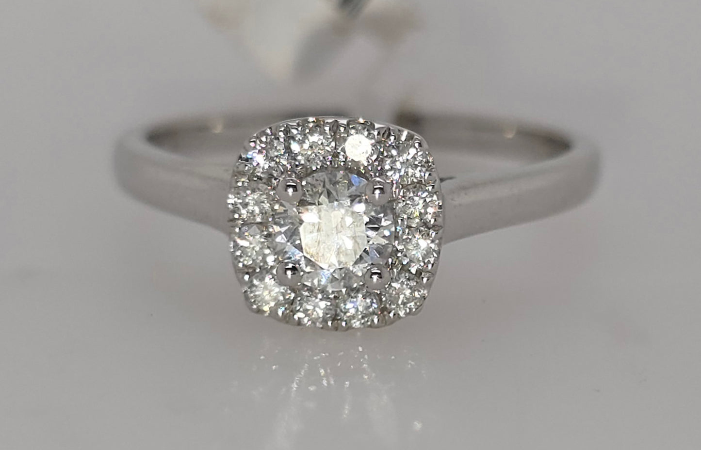 9CT WHITE GOLD HALO DIAMOND RING.