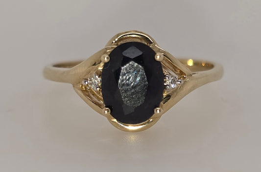 9CT YELLOW GOLD AUSTRALIAN 8MM X 6MM OVAL SAPPHIRE AND DIAMOND RING.