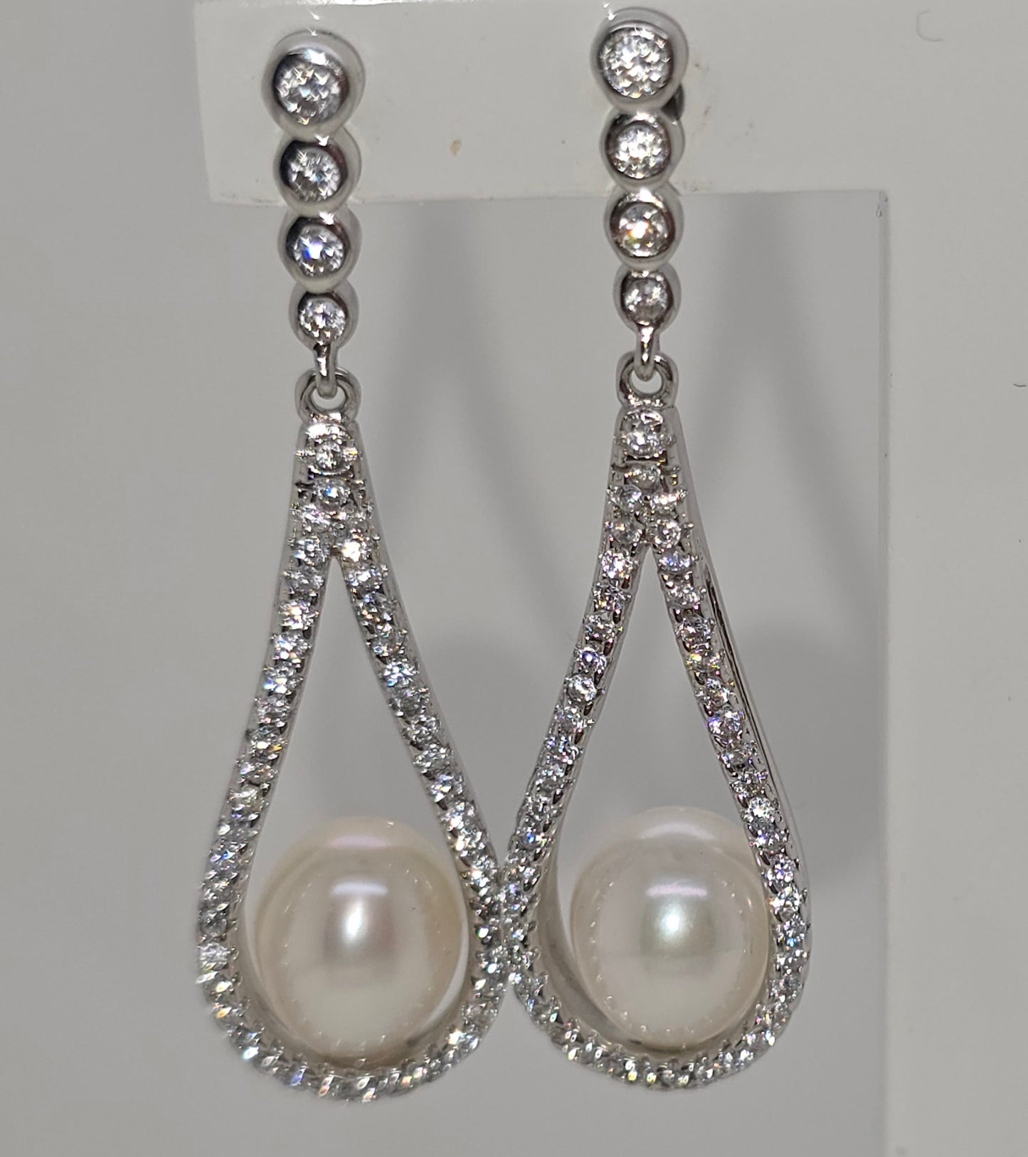STERLING SILVER FRESHWATER PEARL AND CUBIC ZIRCONIA FANCY DROP STUD EARRINGS.