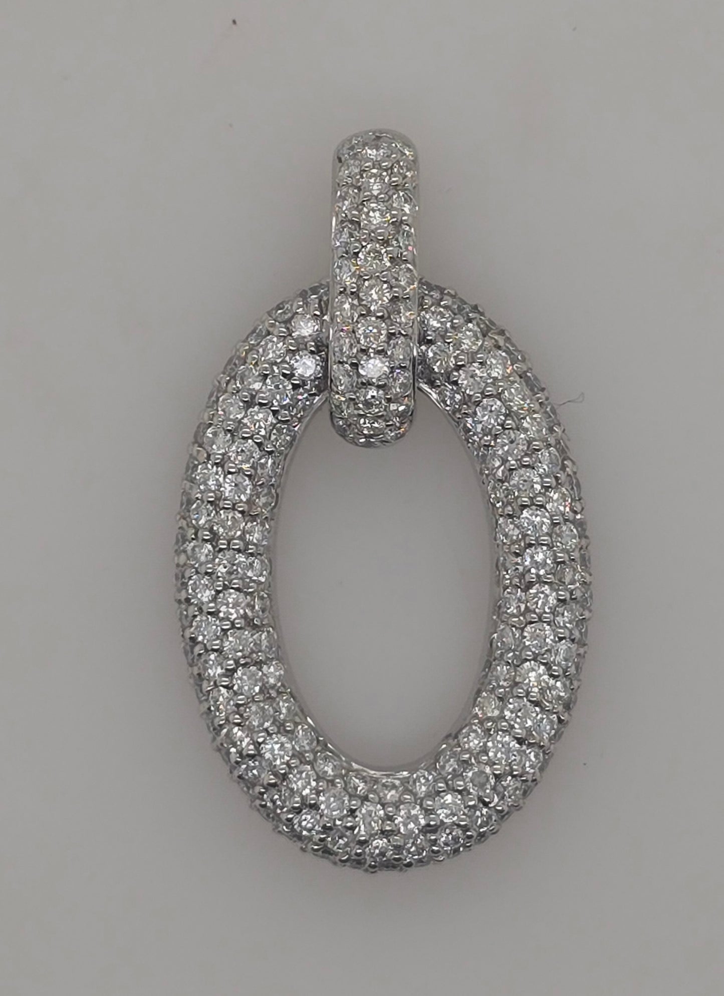 18CT WHITE GOLD DIAMOND OVAL PAVE SET PENDANT