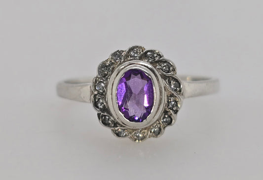 STERLING SILVER BEZEL SET 6 X 4MM AMETHYST RING.