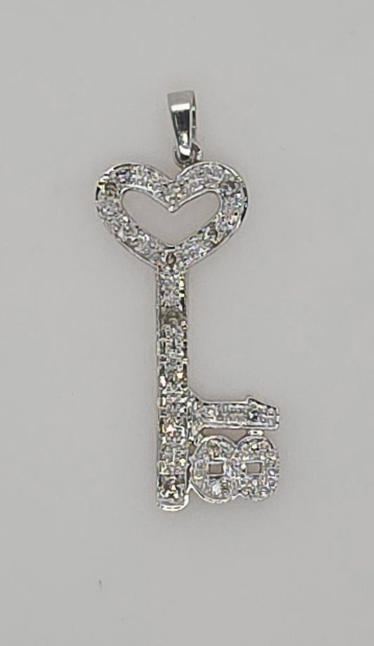 9CT WHITE GOLD DIAMOND 18 KEY PENDANT.