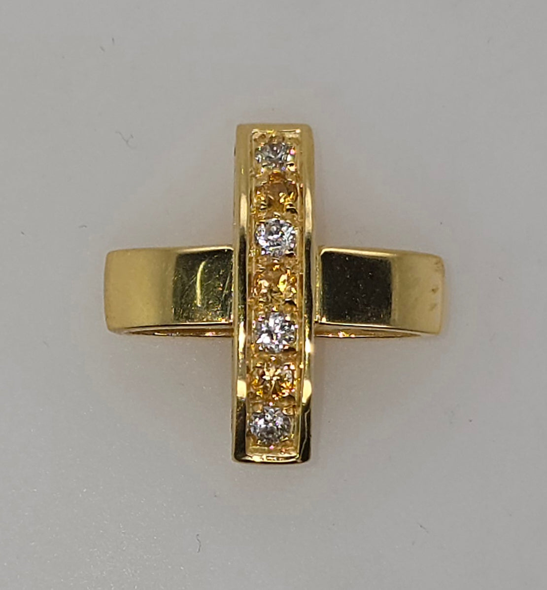18CT YELLOW GOLD CUBIC ZIRCONIA FANCY CROSS PENDANT.