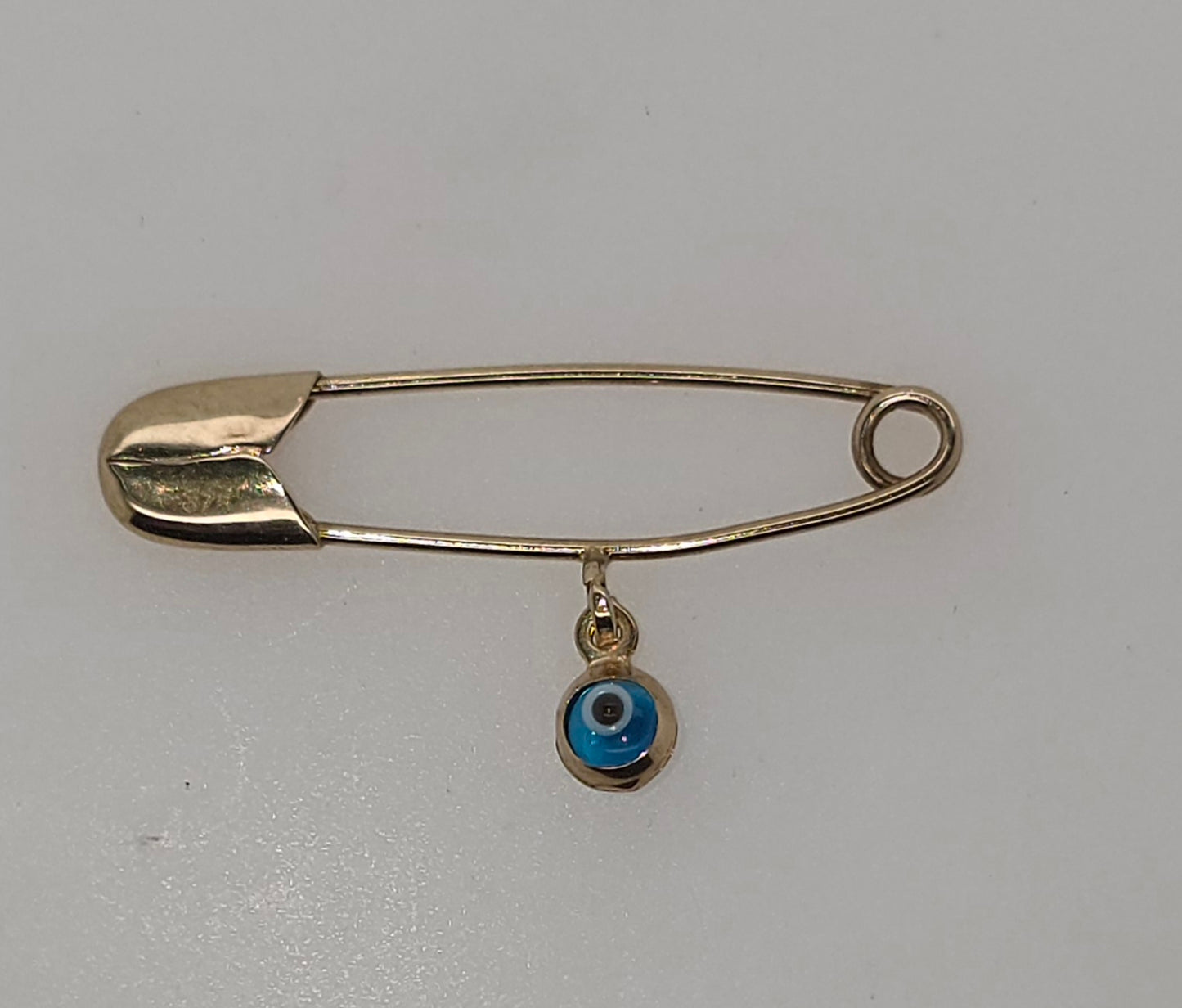 9CT YELLOW GOLD IMPORTED SAFETY PIN WITH 3.8MM EVIL EYE.