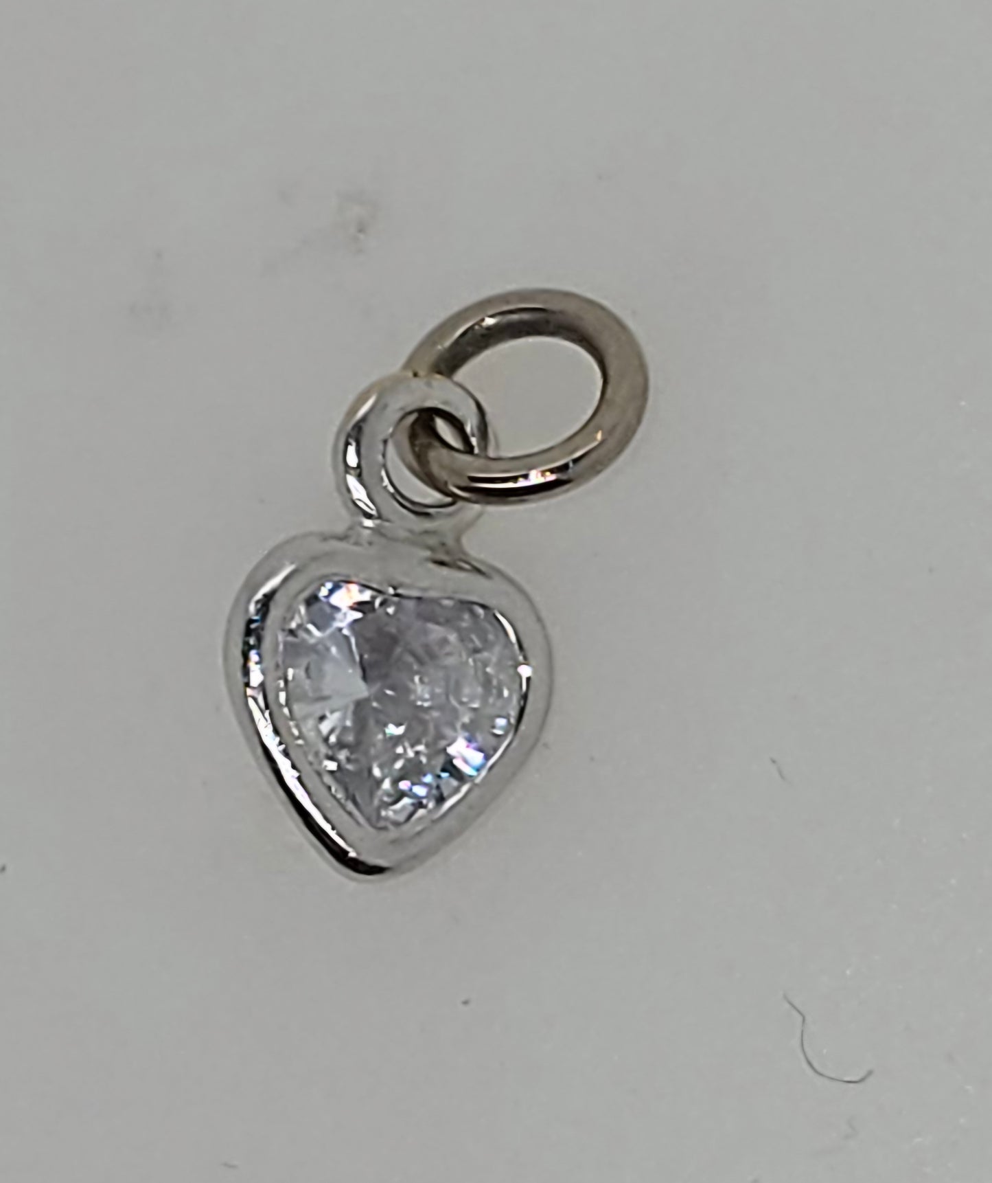 18CT WHITE GOLD IMPORTED 6MM BEZEL SET CUBIC ZIRCONIA HEART CHARM