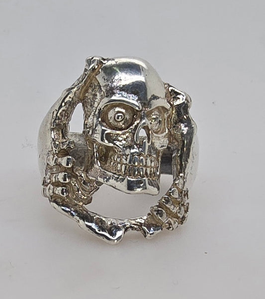 STERLING SILVER FANCY 27MM SKULL RING 16.11GRAMS.