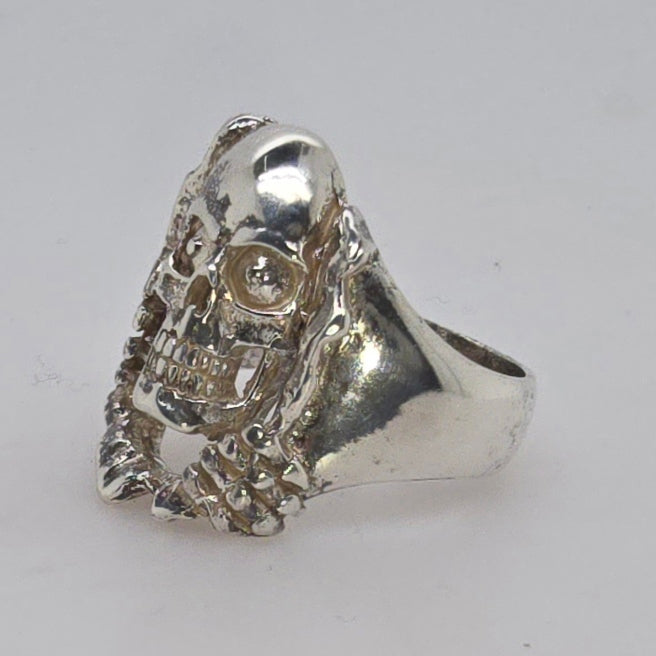 STERLING SILVER FANCY 27MM SKULL RING 16.11GRAMS.