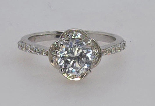 STERLING SILVER RING WITH 6MM ROUND CUBIC ZIRCONIA CENTER.