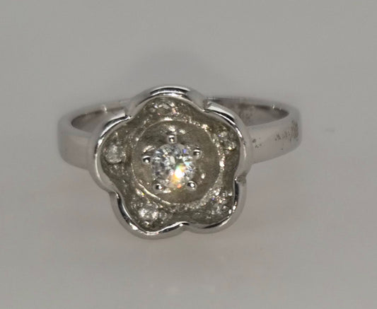 STERLING SILVER 12MM FLOWER DESIGN CUBIC ZIRCONIA CENTER RING.