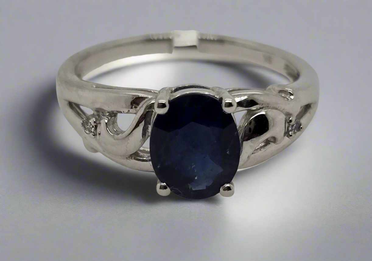 9CT WHITE GOLD OVAL SAPPHIRE 1.60CT 8 X 6MM AND DIAMOND RING.