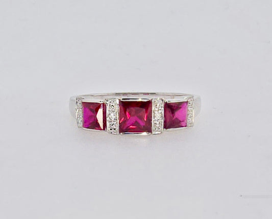 9CT WHITE GOLD CREATED RUBY AND DIAMOND RING.