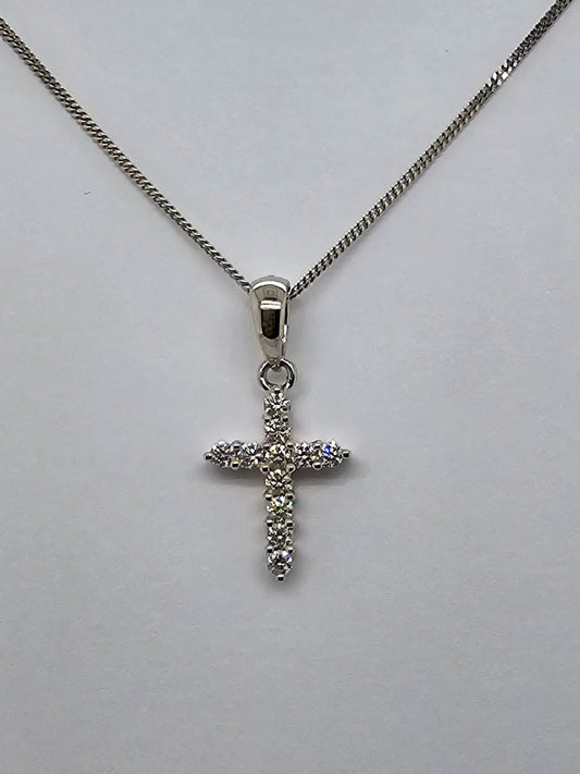 18CT WHITE GOLD CLAW SET DIAMOND CROSS.