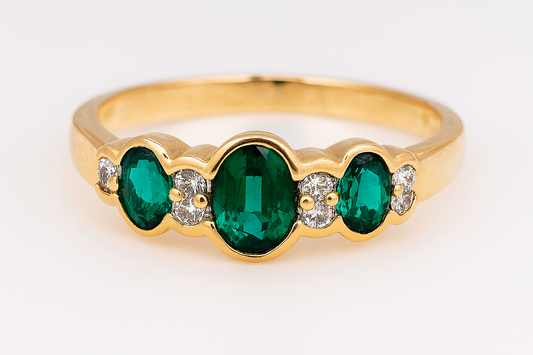 9CT YELLOW GOLD CREATED EMERALD AND DIAMOND RING.