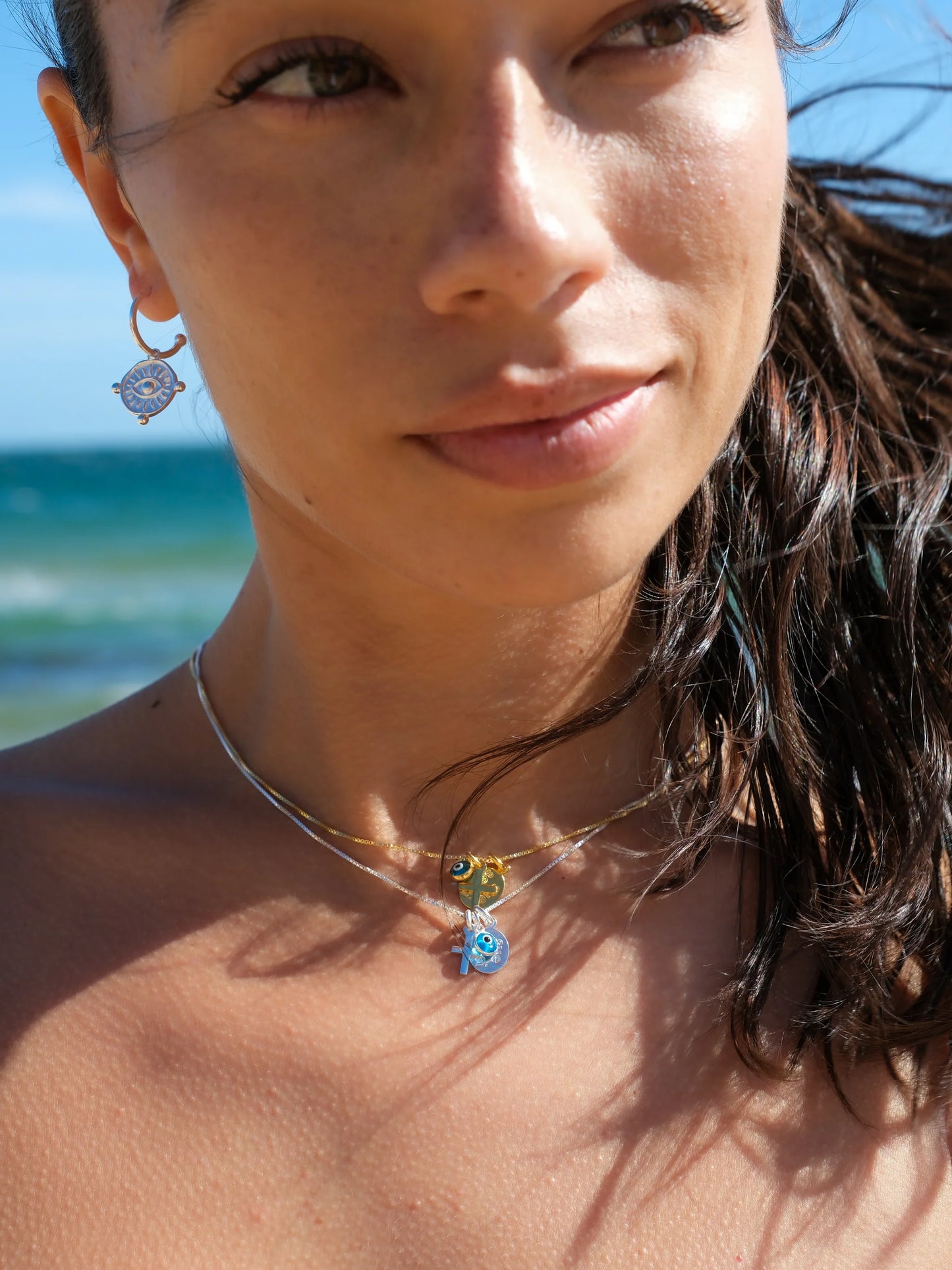SUE SENSI STERLING SILVER GOLD PLATED REACH FOR THE SKY CROSS NECKLACE.